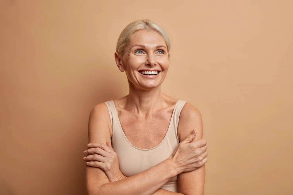 Woman with healthy glowing skin showing natural skin rejuvenation and improved texture after microneedling treatment
